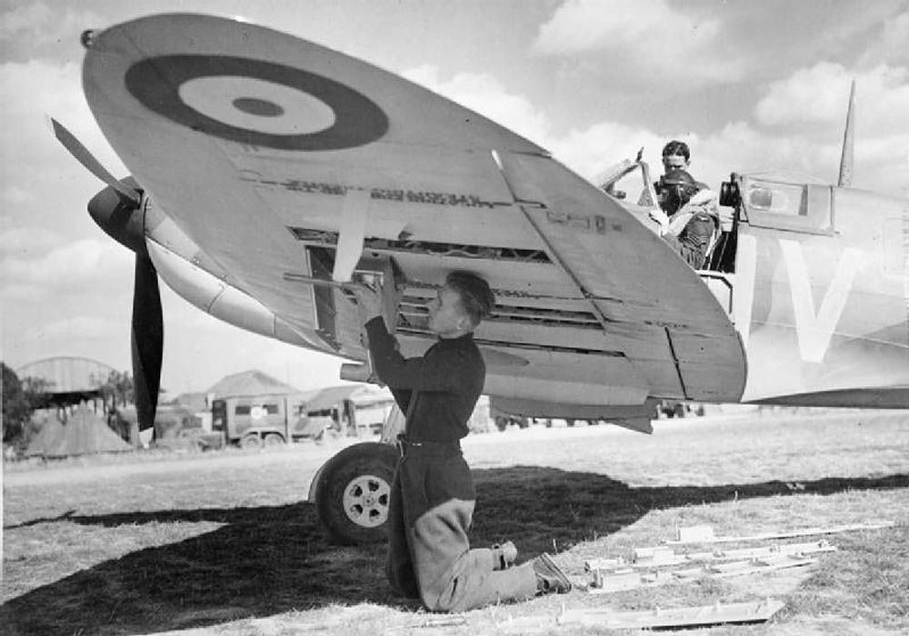 A Supermarine Spitfire Mark IA of No. 19 Squadron RAF at Fowlmere is prepared for the next mission. (Imperial War Museum Photograph.)