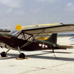 Color photograph of Tumbleweed, a U.S. Navy Stinson OY-1 Sentinel. (U.S. Navy Photograph.)