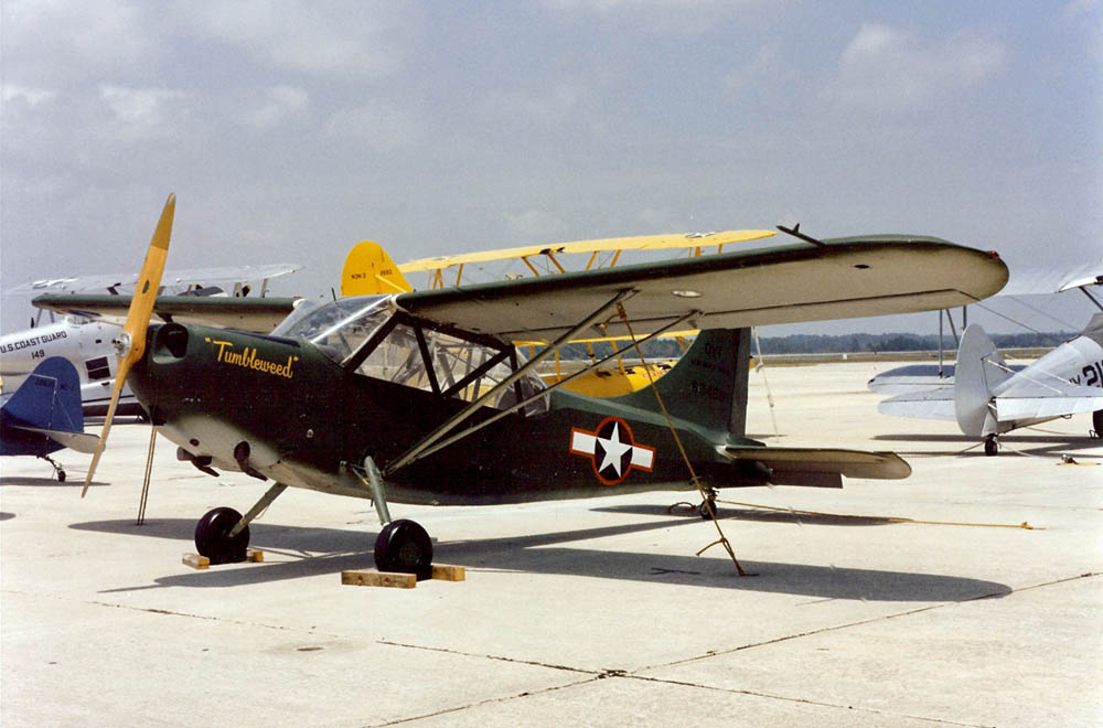 Color photograph of Tumbleweed, a U.S. Navy Stinson OY-1 Sentinel. (U.S. Navy Photograph.)