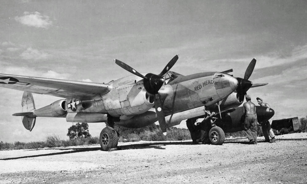 Lockheed P-38 Lightning "Little Red Head" photographed on Saipan in the Marianas, November 1944. (U.S. Air Force Photograph.)
