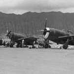 Republic P-47 Thunderbolt fighters of the 318th Fighter Group are serviced by mechanics at Bellows Field, Oahu, Hawaii, May 1944. (U.S. Air Force Photograph.)