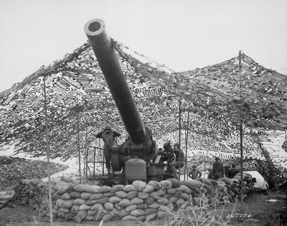 A 240mm howitzer of Battery B, 697th Field Artillery Battalion prepares to fire near Mignano, Italy during WWII. (U.S. Army Photograph.)