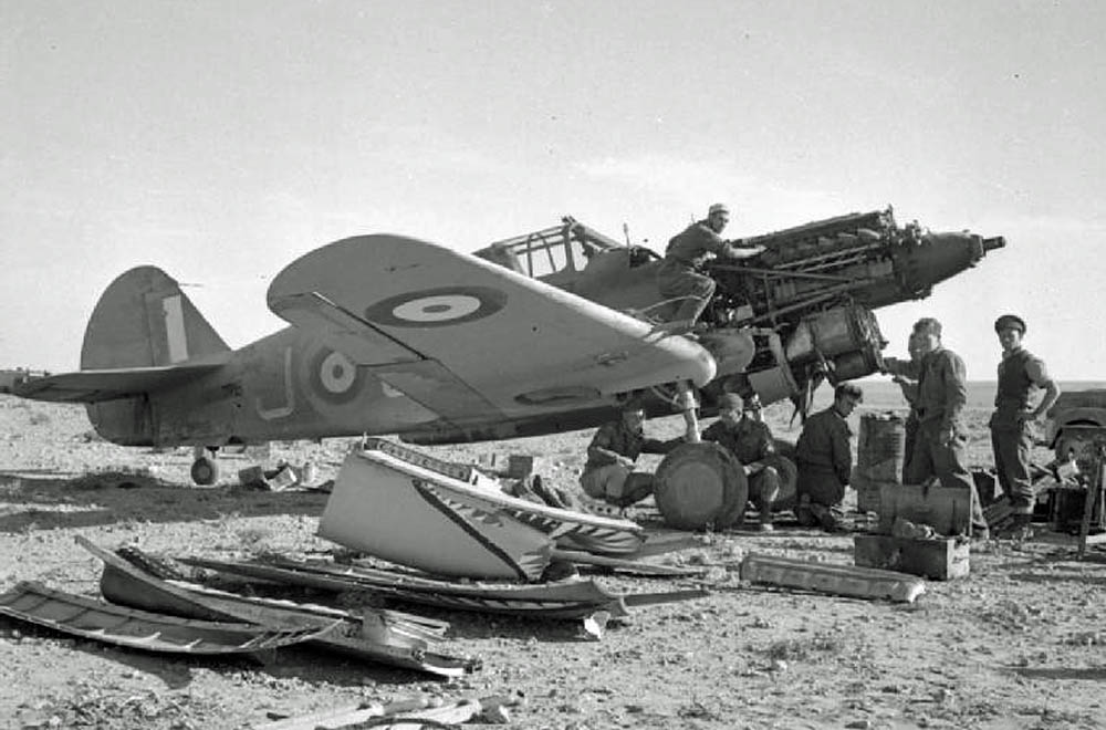 RAF mechanics change the engine on a Curtiss Tomahawk Mark IIB of No. 112 Squadron RAF in the Western Desert, 1941. (Imperial War Museum Photograph.)
