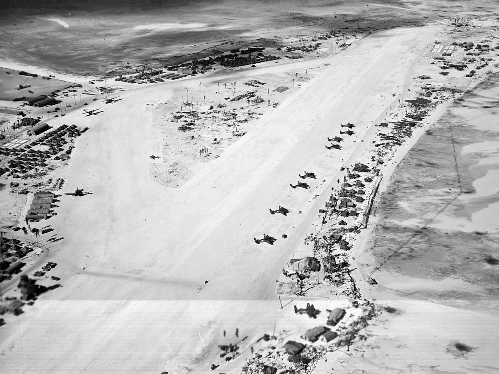 Aerial photograph of Hawkins Field on Betio Island, Tarawa Atoll, Gilbert Islands in March 1944 with a variety of aircraft visible. (U.S. Navy Photograph.)