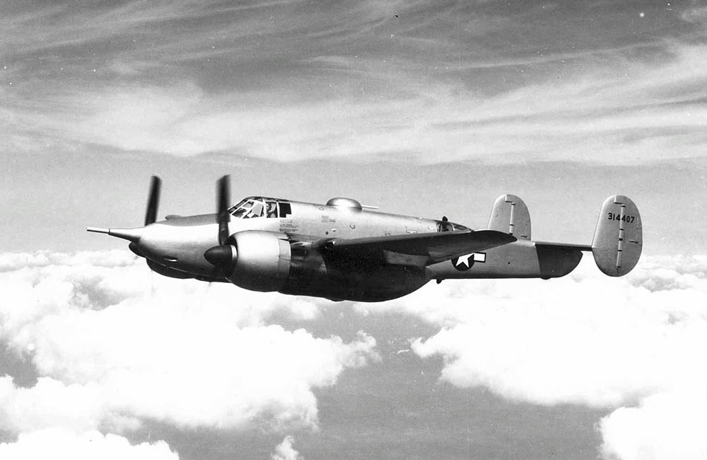 A Beechcraft XA-38 Grizzly prototype in flight showing the forward-firing 75mm cannon. (U.S. Air Force Photograph.)