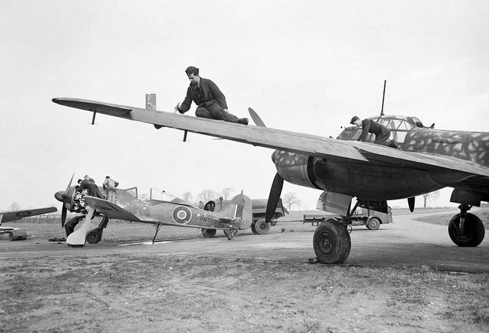 A captured Junkers Ju 88 bomber and Focke Wulf FW 190 fighter of RAF Enemy Aircraft Flight at Collyweston, Northamptonshire, February 1945. (Imperial War Museum Photograph.)