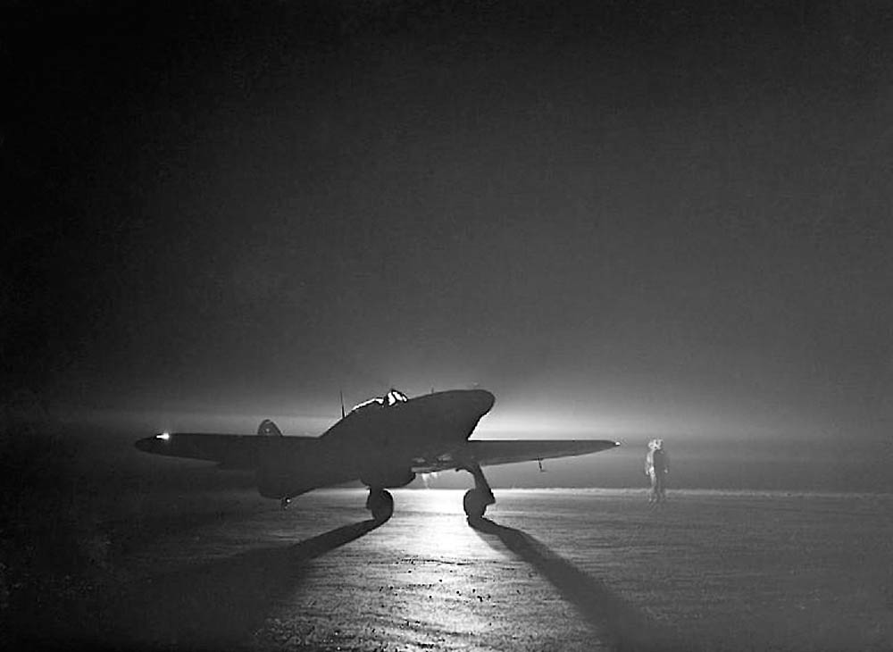 A Hawker Hurricane Mark I night fighter prepares for a night takeoff at Debden, Essex to intercept German raiders, March 1941. (Imperial War Museum Photograph.)