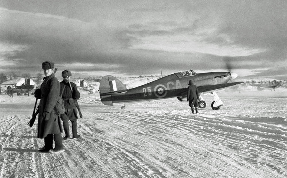 An RAF Hawker Hurricane Mk IIB fighter photographed with Russian sentries near Murmansk, October 1941. (Imperial War Museum Photograph.)