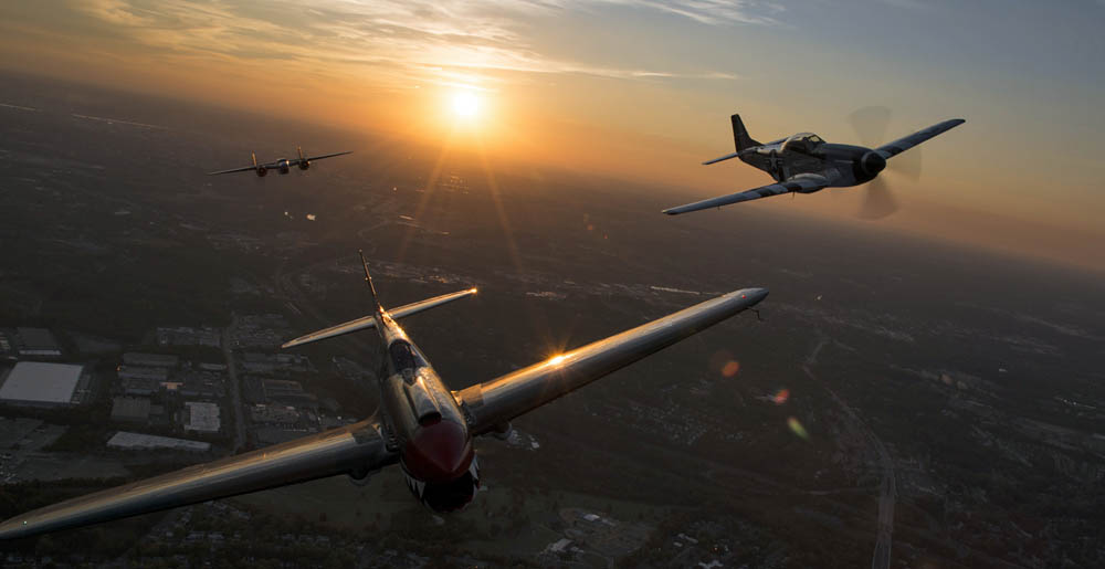 A P-40 Warhawk, P-51 Mustang and a B-25 Mitchell fly over Joint Base Anacostia-Bolling, Washington, during a Military Tattoo on base Sept. 16, 2015.
