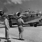 Officers watch the Consolidated B-24 Liberator Bolivar Jr. as the aircraft taxis on Saipan, Mariana Islands in May 1945. (U.S. Air Force Photograph.)