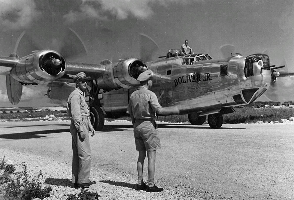 Officers watch the Consolidated B-24 Liberator Bolivar Jr. as the aircraft taxis on Saipan, Mariana Islands in May 1945. (U.S. Air Force Photograph.)