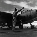 A TBM-1C Avenger receives the takeoff signal on the Independence-class light aircraft carrier USS San Jacinto (CVL-30) in May 1944. (U.S. Navy Photograph.)