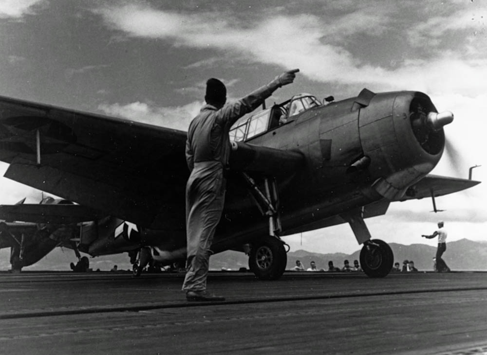 A TBM-1C Avenger receives the takeoff signal on the Independence-class light aircraft carrier USS San Jacinto (CVL-30) in May 1944. (U.S. Navy Photograph.)