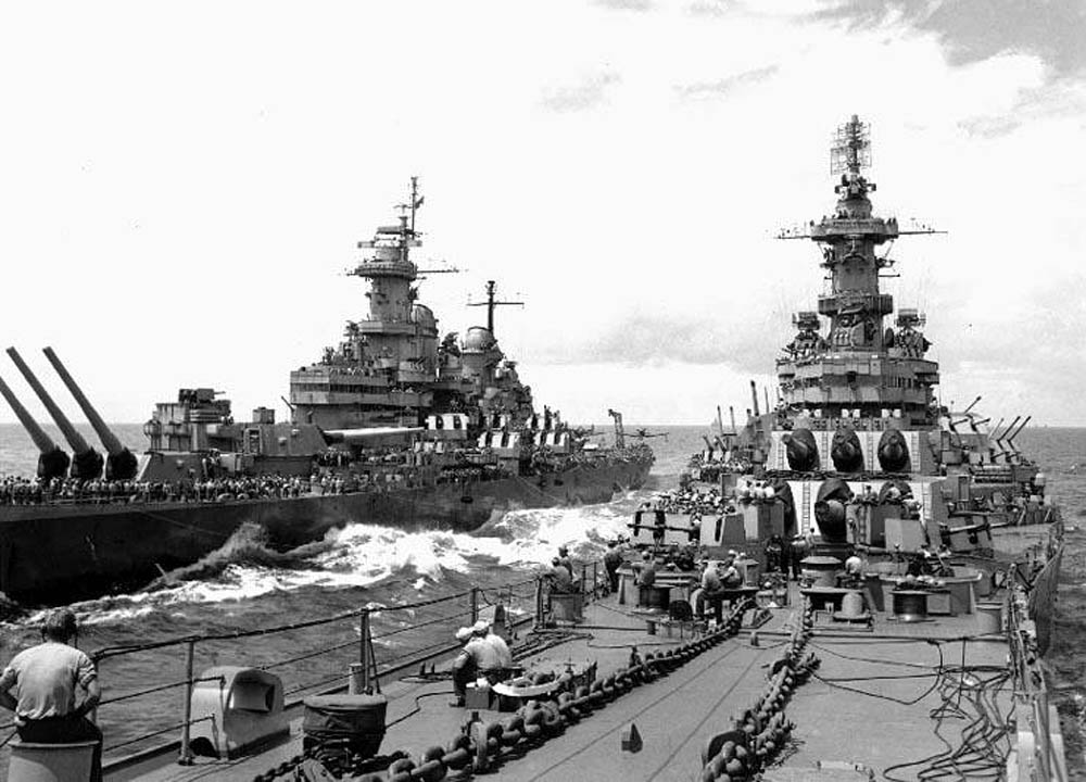 The battleships USS Missouri (BB-63), left, transfers supplies and personnel to the USS Iowa (BB-61), right, off the Japanese coast in August 1945. (U.S. Navy Photograph.)