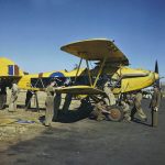 Women's Auxiliary Air Force (WAAF) and RAF trainee ground crew perform maintenance work on a Hawker Hart biplane as part of the Commonwealth Joint Air Training Plan at Waterkloof near Pretoria, South Africa. (Imperial War Museum Photograph.)