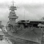 The U.S. Navy aircraft carrier USS Yorktown (CV-5) under repair in the drydock at Pearl Harbor Navy Yard in May 1942. (Official U.S. Navy Photograph.)
