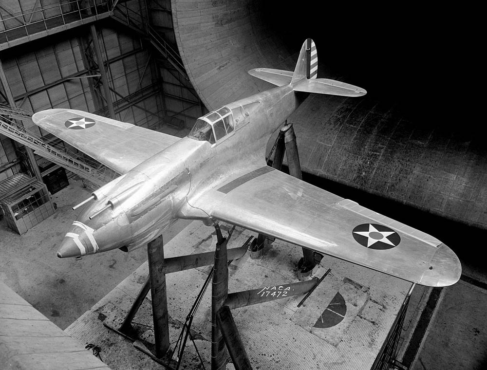 The Curtiss XP-40 Warhawk fighter undergoes drag-reduction testing in the full-scale wind tunnel at Langley Research Center in 1939. (NASA Photograph.)