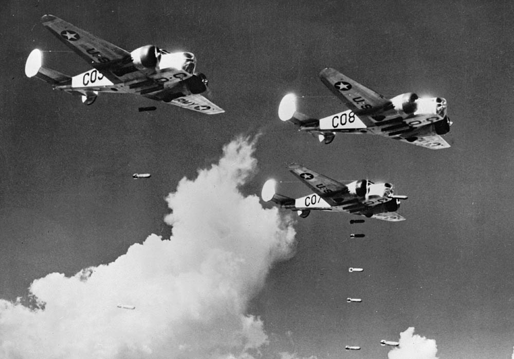 Beech AT-11 Kansans from the U.S. Army Air Forces fly a training mission from an advanced flying school dropping practice bombs near Carlsbad, New Mexico in February 1943. (U.S. Army Air Forces Photograph.)
