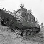 The remains of a destroyed German Panther tank sit on the roadside near Trarivi, Italy in September 1944. (Imperial War Museum Photograph.)