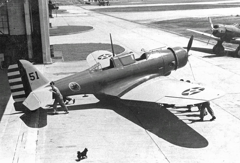 A squadron mascot guards a Northrop A-17 attack bomber of the 74th Attack Squadron, 16th Pursuit Group. (U.S. Air Force Photograph.)