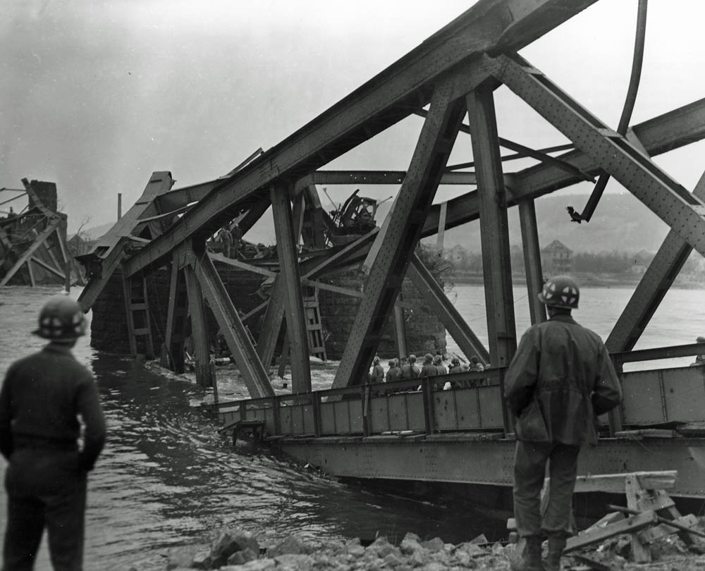 U.S. First Army soldiers at the Remagen Bridge over the Rhine after the bridge's collapse. (U.S. National Archives Photograph.)