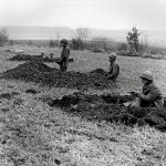 U.S. Army soldiers from the 630th Tank Destroyer Battalion dig positions on a hill near Wiltz, Belgium during the Battle of the Bulge in December 1944. (Signal Corps Photograph.)
