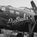 The Boeing B-17 Flying Fortress "Dog Breath" of the 452nd Bomb Group receives a touchup on its nose art in England in April 1944. (U.S. Air Force Photograph.)