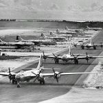 Boeing B-29 Superfortress bombers of the 462nd Bomb Group line up on West Field, Tinian Island in the Mariana Islands, 1945. (U.S. Air Force Photograph.)