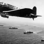 A SB2U Vindicator from the USS Ranger flies patrol over Convoy WS-12 en route to Cape Town, South Africa in November 1941. (U.S. Navy Photograph.)