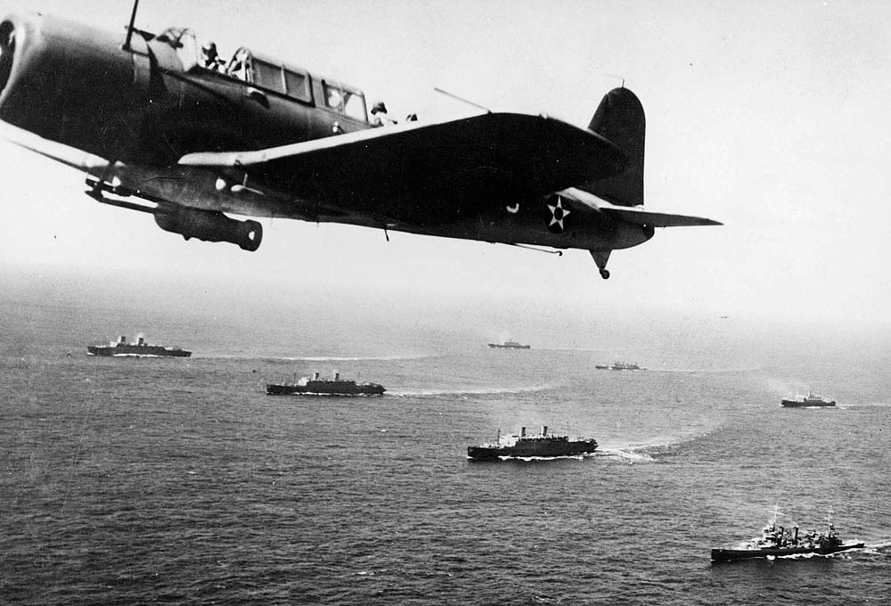 A SB2U Vindicator from the USS Ranger flies patrol over Convoy WS-12 en route to Cape Town, South Africa in November 1941. (U.S. Navy Photograph.)