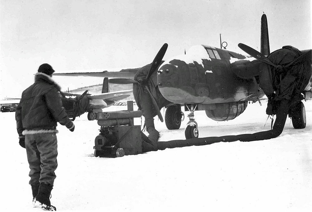 Engines are heated on a Lend-Lease Douglas A-20G in Alaska in preparation for delivery to Russia. (U.S. Air Force Photograph.)
