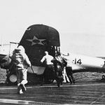 Sailors on the USS Yorktown rush to aid a Northrop BT-1 bomber of Bombing Squadron Five (VB-5) after a landing accident, circa 1940. (Official U.S. Navy Photograph.)
