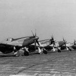 A lineup of P-51 Mustang fighters of the 359th Fighter Group, 20th Fighter Group, 353rd Fighter Group, and 357th Fighter Group photographed at RAF Debden, home of the 4th Fighter Group. (United States Army Air Forces Photograph.)