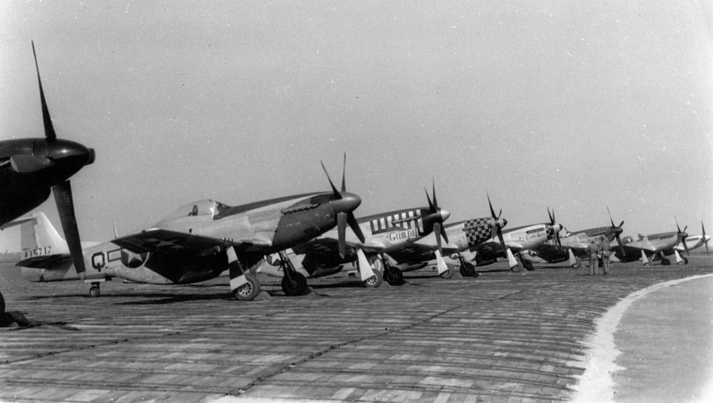 A lineup of P-51 Mustang fighters of the 359th Fighter Group, 20th Fighter Group, 353rd Fighter Group, and 357th Fighter Group photographed at RAF Debden, home of the 4th Fighter Group. (United States Army Air Forces Photograph.)