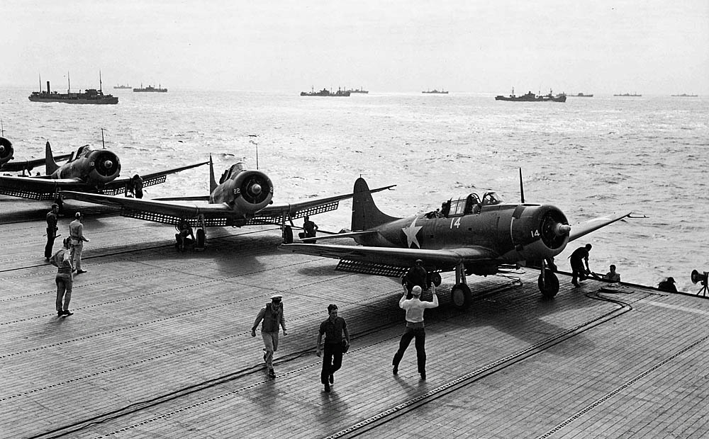 U.S. Navy Douglas SBD Dauntless dive bombers from VC-29 prepare for antisubmarine patrol on the flight deck of the escort carrier USS Santee (ACV-29) during operations in the Atlantic. (U.S. Navy Photograph.)