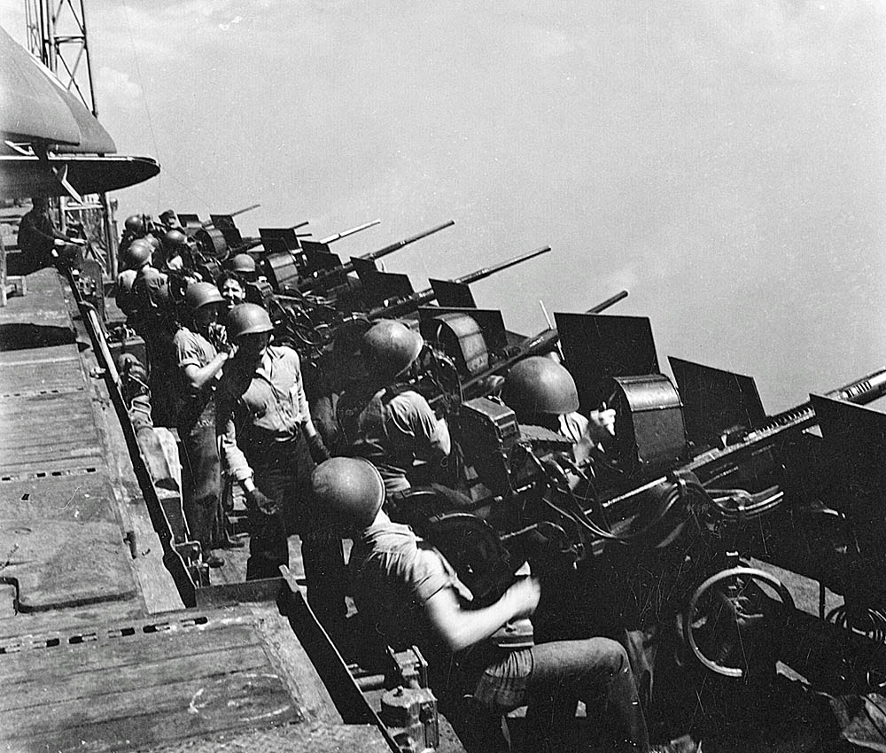 Sailors man 20mm Oerlikon antiaircraft guns on the catwalk of the aircraft carrier USS Hornet (CV-12) in February 1945. (U.S. National Archives and Records Admin. Photo.)