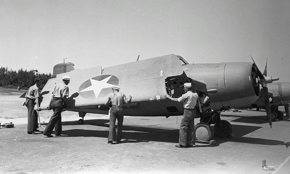 A U.S. Navy Grumman F4F-4 Wildcat fighter of Fighting Squadron Three (VF-3) photographed at Naval Air Station Kaneohe, Oahu in May 1942 with ground crew. (Official U.S. Navy Photograph.)