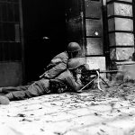 A U.S. Army machine gun crew from the 26th Infantry fire a M1919 Browning during street fighting in Aachen, Germany in October 1944. (U.S. Army Photograph.)