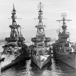 Three U.S. Navy heavy cruisers -- USS Salt Lake City (CA-25), USS Pensacola (CA-24) and USS New Orleans (CA-32) -- docked together at Pearl Harbor in October 1943. (Official U.S. Navy Photograph.)
