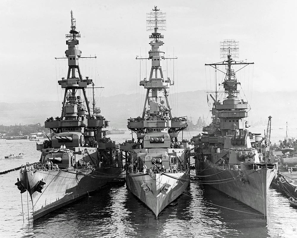 Three U.S. Navy heavy cruisers -- USS Salt Lake City (CA-25), USS Pensacola (CA-24) and USS New Orleans (CA-32) -- docked together at Pearl Harbor in October 1943. (Official U.S. Navy Photograph.)
