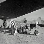 British officers unload luggage and equipment from a Bristol Bombay of No. 216 Squadron after landing at Maleme, Crete in 1941. (Imperial War Museum Photograph.)
