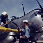 U.S. Navy mechanics at Naval Air Station Corpus Christi, Texas refuel a Curtiss SNC-1 Falcon trainer in August 1942. (U.S. Library of Congress Photograph.)