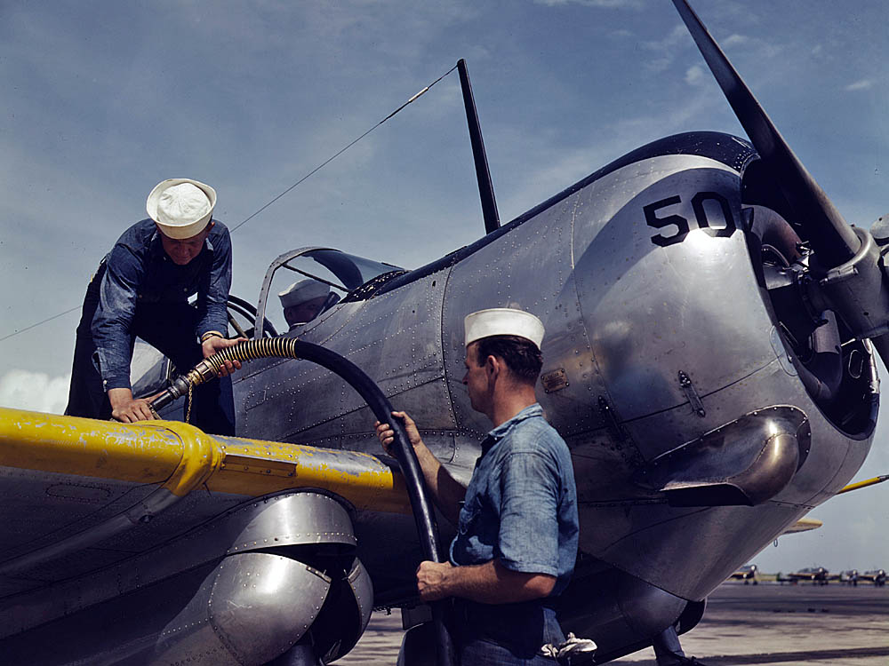 U.S. Navy mechanics at Naval Air Station Corpus Christi, Texas refuel a Curtiss SNC-1 Falcon trainer in August 1942. (U.S. Library of Congress Photograph.)