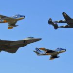 A P-38 Lightning leads an aircraft formation of an F-22 Raptor and F-86 Sabres during the 2015 Heritage Flight Training and Certification Course at Davis-Monthan Air Force Base, Arizona. (U.S. Air Force Photograph by S/Sgt. Courtney Richardson / Released.)