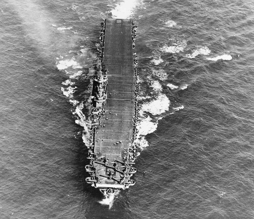 The aircraft carrier USS Enterprise (CV-6) underway in the Pacific in March 1944 with the flight deck crowded with Douglas SBD-5 Dauntless aircraft of Bombing Squadron 10 (VB-10). (U.S. Navy Photograph.)