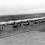 New B-25s and P-39s, bound for Russia as part of the Lend-Lease program, wait on the runway at Ladd Field, Alaska in September 1942. (U.S. Air Force Photograph.)