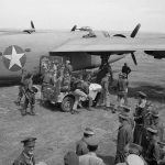 B-24 Liberator crews from the U.S. 9th Air Force receive a briefing from Major Frank W. Delong, squadron commander, before a mission over Axis territory. (Library of Congress Photograph.)