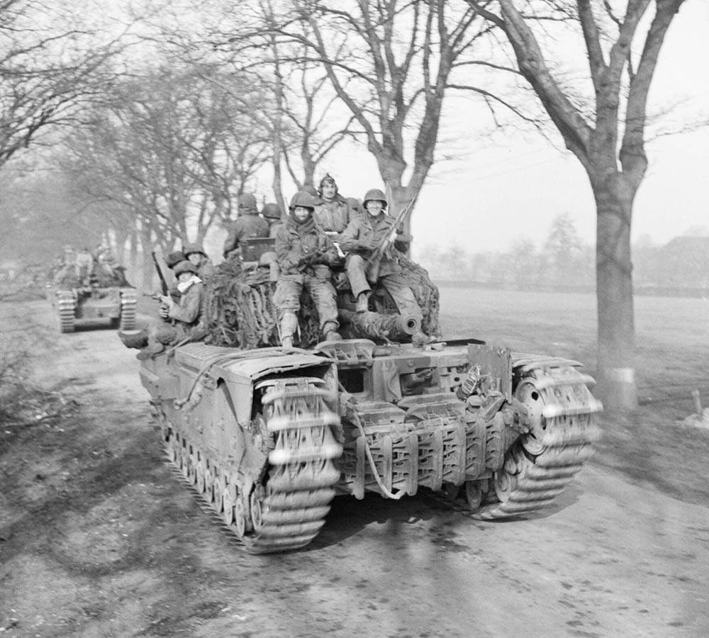 Churchill tanks of 6th Guards Tank Brigade carry U.S. Army paratroopers of the 17th Airborne Division forward in Germany in March 1945. (Imperial War Museum Photograph.)