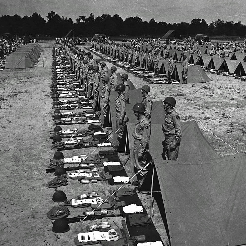 Soldiers of the 347th Infantry Regiment, 87th Infantry Division line-up for inspection during the Second Army Tennessee Maneuvers. (U.S. Army Signal Corps Photograph.)