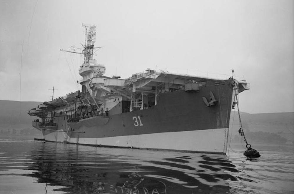 The Royal Navy escort carrier HMS Arbiter (D31) moored at Greenock, Scotland in July 1944. (Imperial War Museums Collection.)